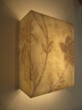 This beautiful hand painted paper wall light is made by artist Hannah Woodhouse